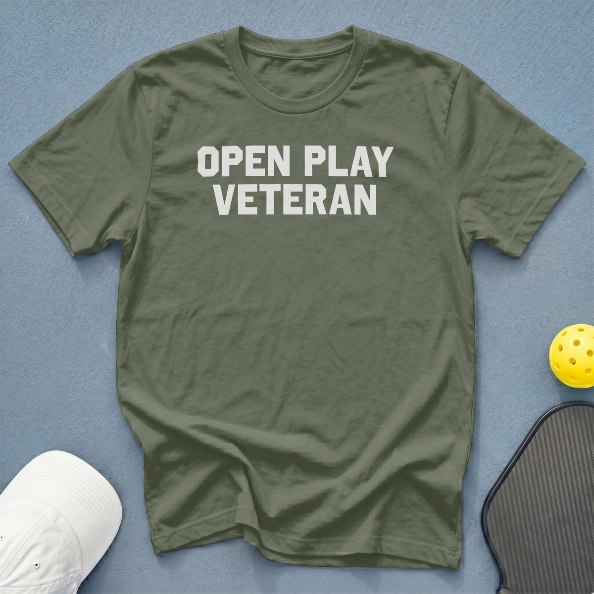 Olive green t-shirt with white "OPEN PLAY VETERAN" text.
