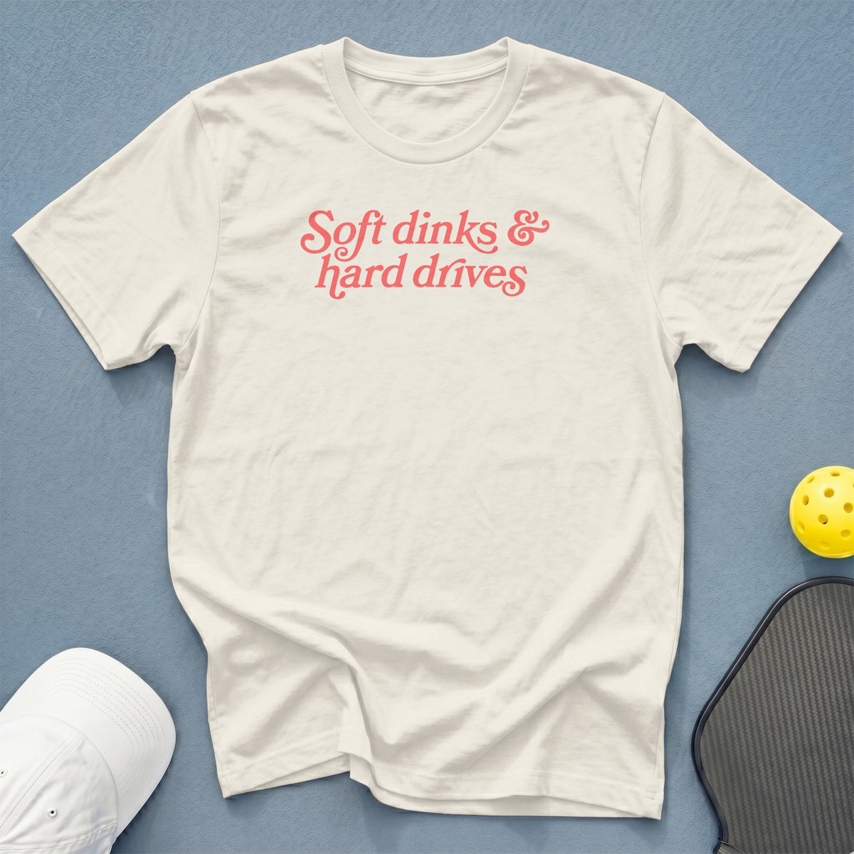 Cream t-shirt with pink text "Soft dinks & hard drives".