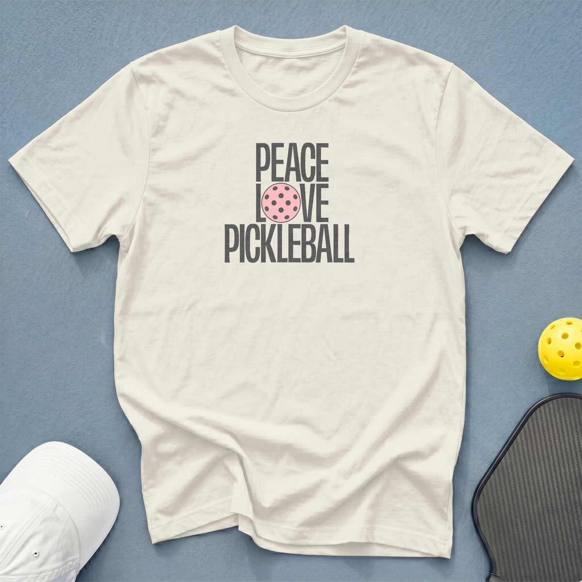 Cream t-shirt with "Peace Love Pickleball" graphic and pink pickleball icon.
