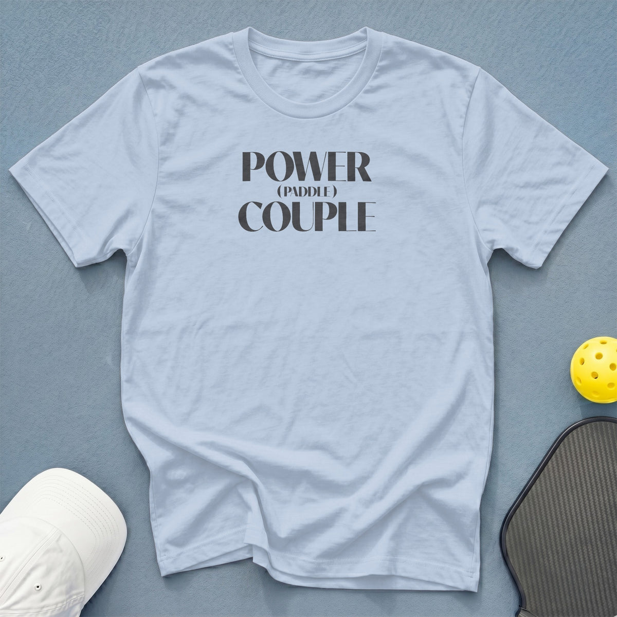 Light blue t-shirt with "POWER (PADDLE) COUPLE" text.