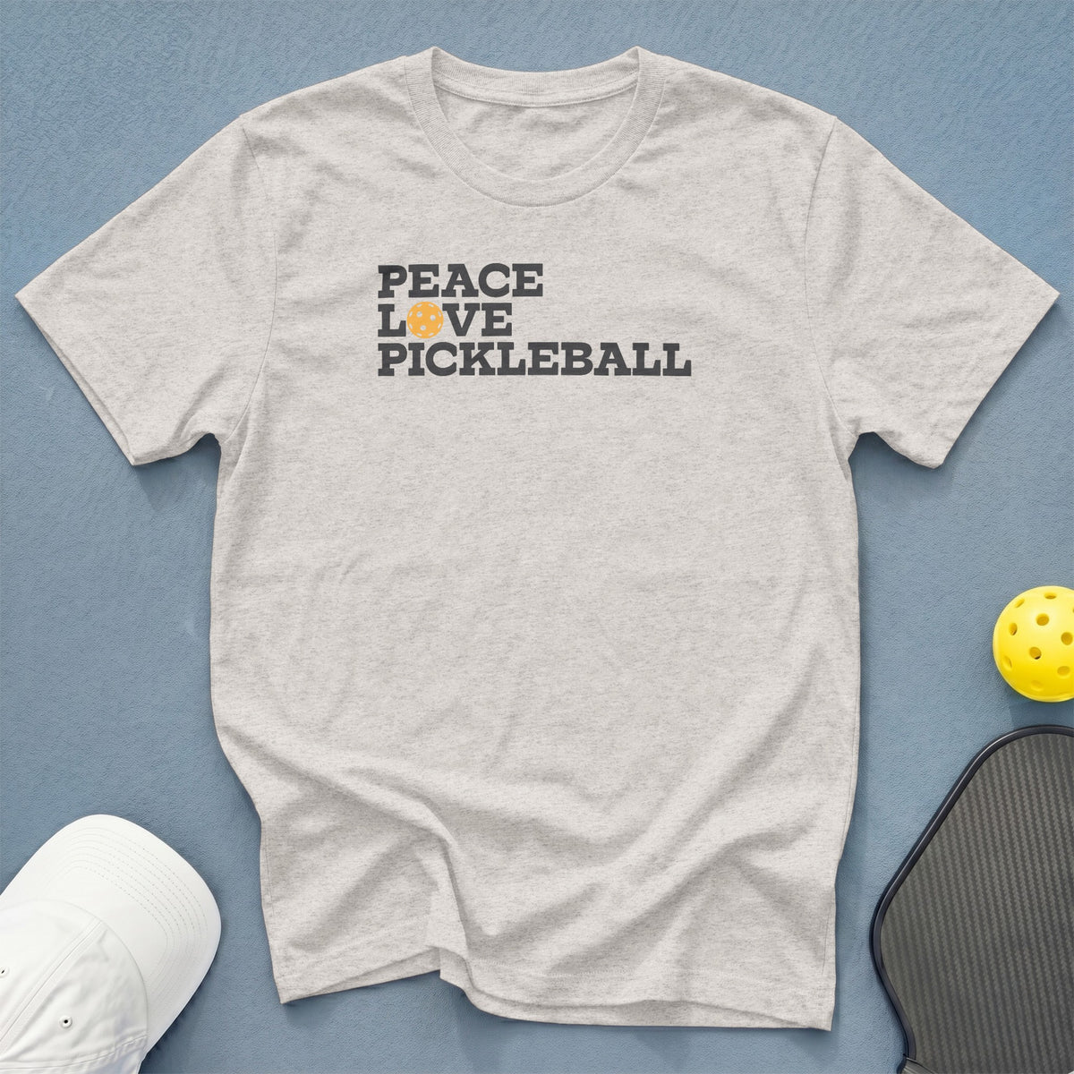 Light gray t-shirt with "Peace Love Pickleball" text and a pickleball graphic.