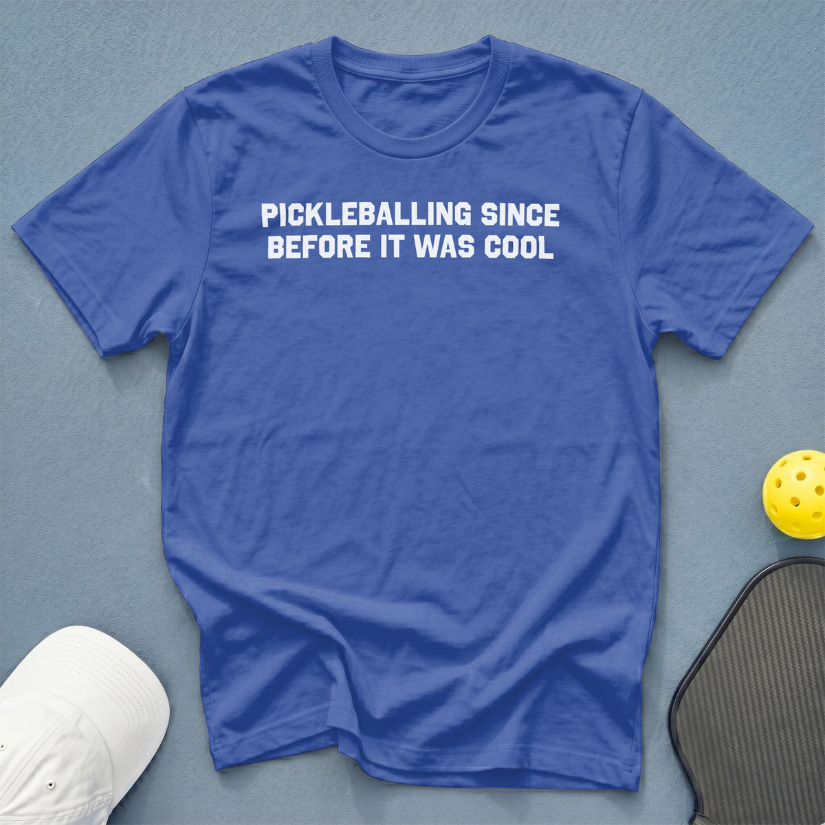Blue t-shirt with white text "PICKLEBALLING SINCE BEFORE IT WAS COOL".