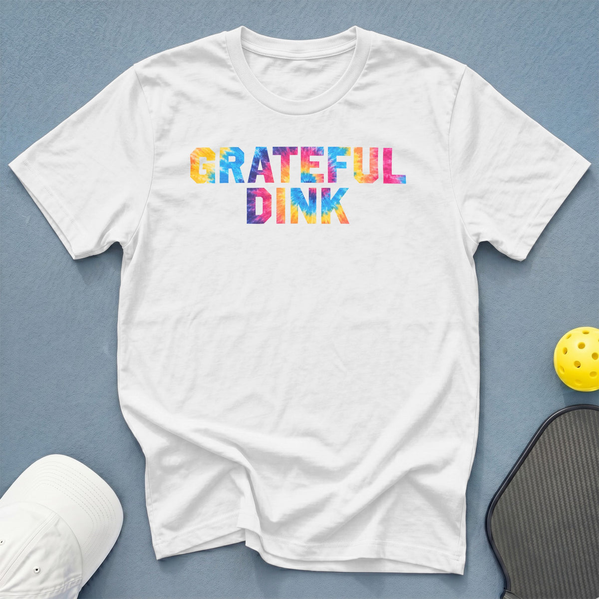 White t-shirt with "Grateful Dink" in a tie-dye pattern.