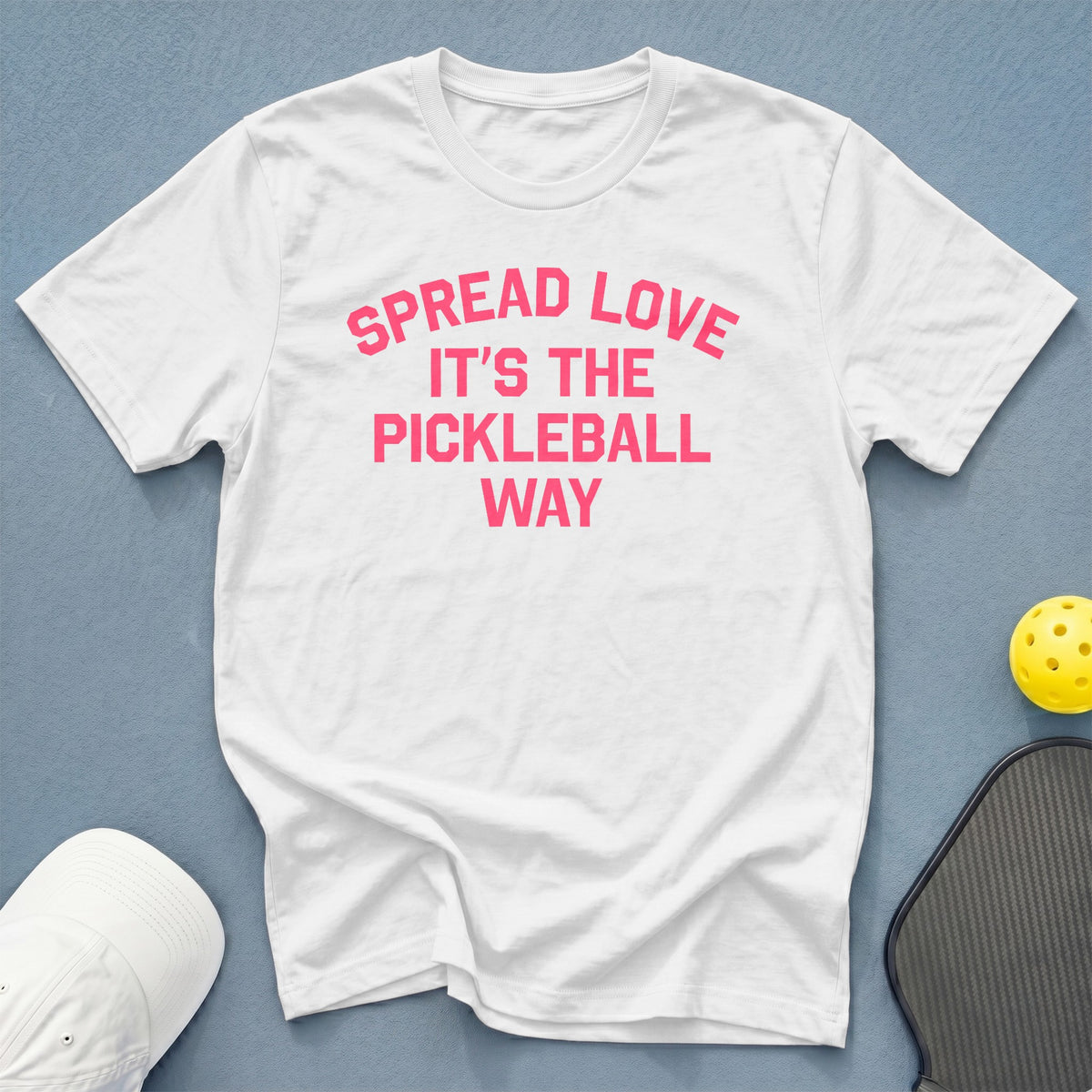 White t-shirt with pink text: "Spread Love. It's the Pickleball Way."