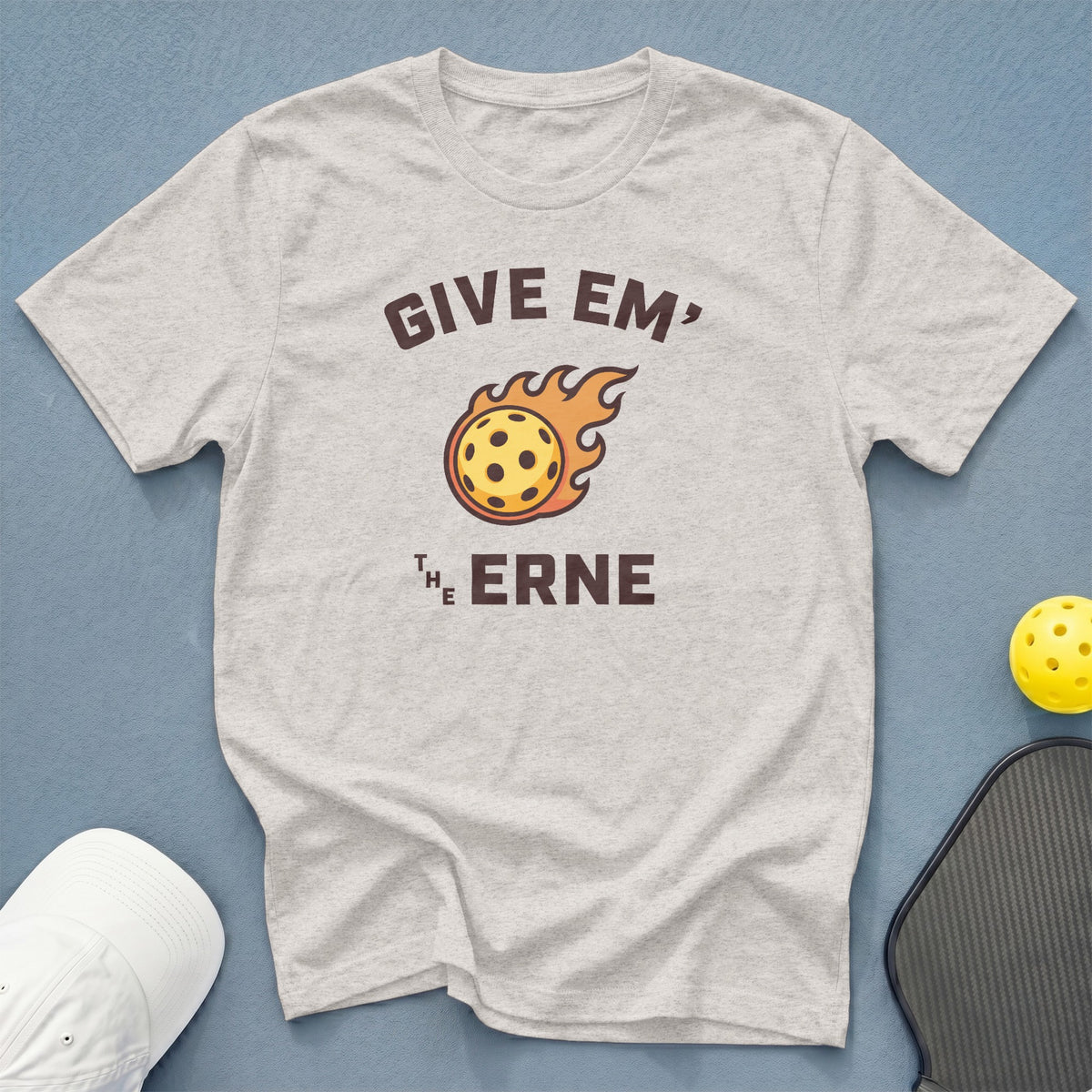 Light grey t-shirt with "GIVE EM' THE ERNE" and flaming pickleball graphic.