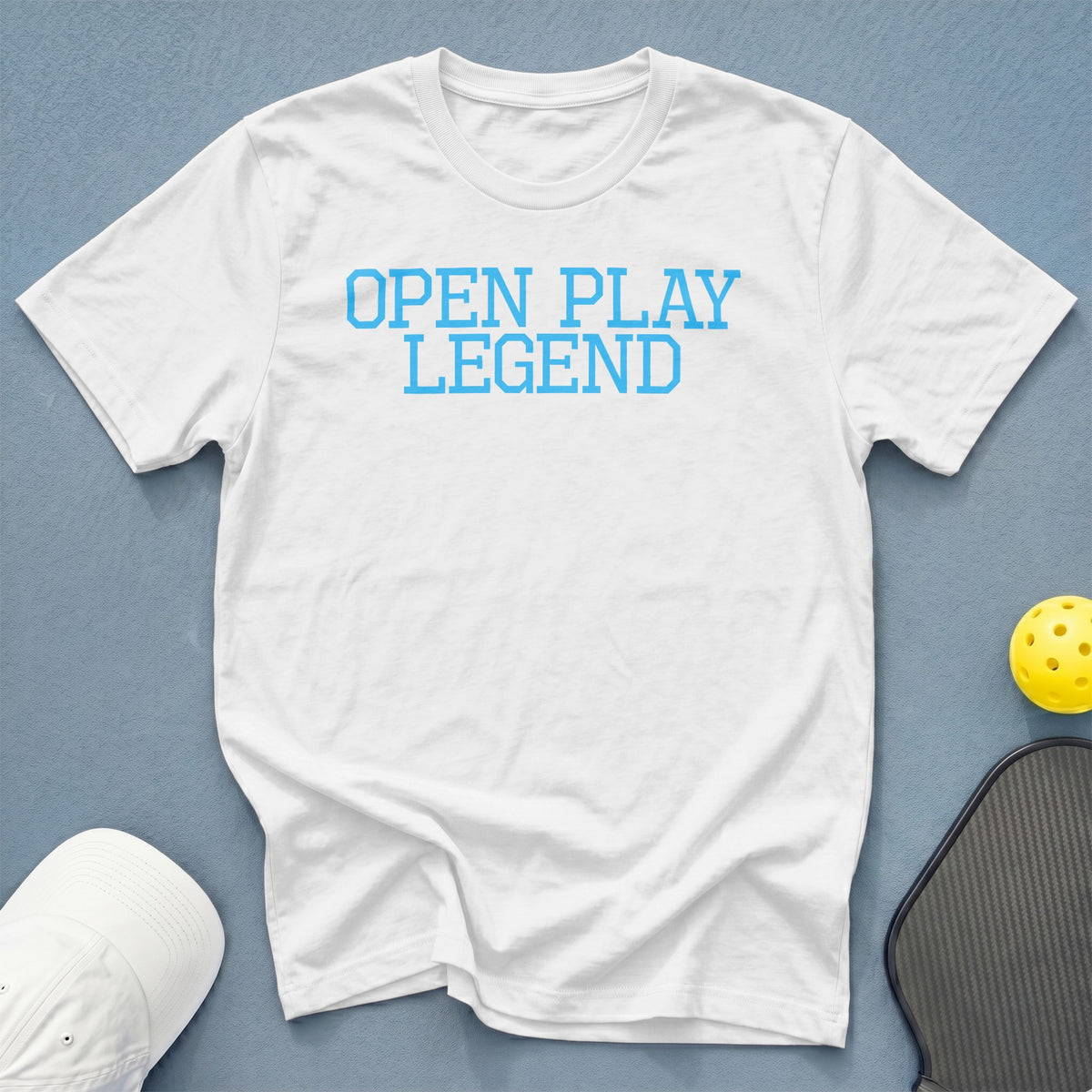 White t-shirt with "OPEN PLAY LEGEND" text in blue.