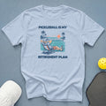 Light blue t-shirt with "PICKLEBALL IS MY RETIREMENT PLAN" graphic.