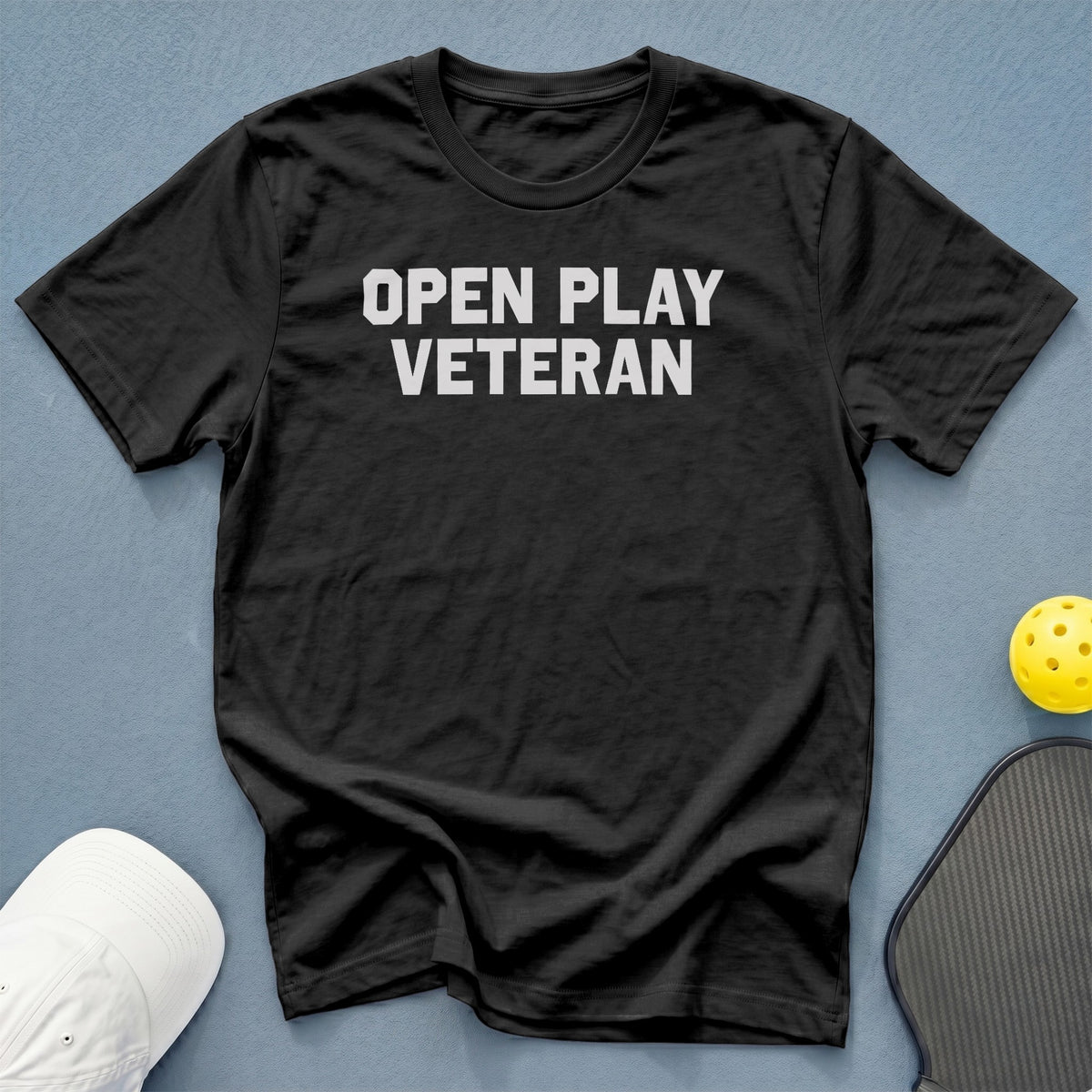 Black t-shirt with white text "OPEN PLAY VETERAN".