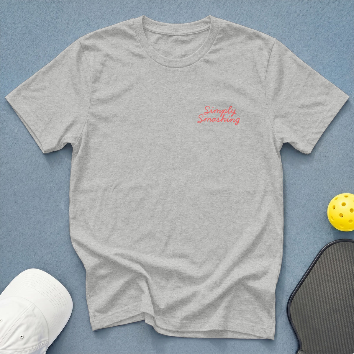 Light grey t-shirt with pink text "Simply Smashing" on the left chest.