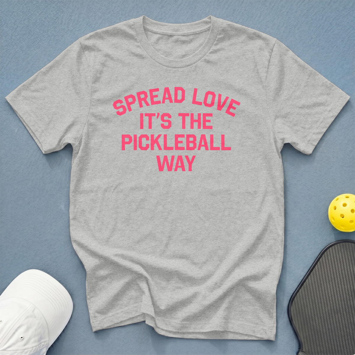 Gray t-shirt with pink text "Spread Love It's the Pickleball Way".