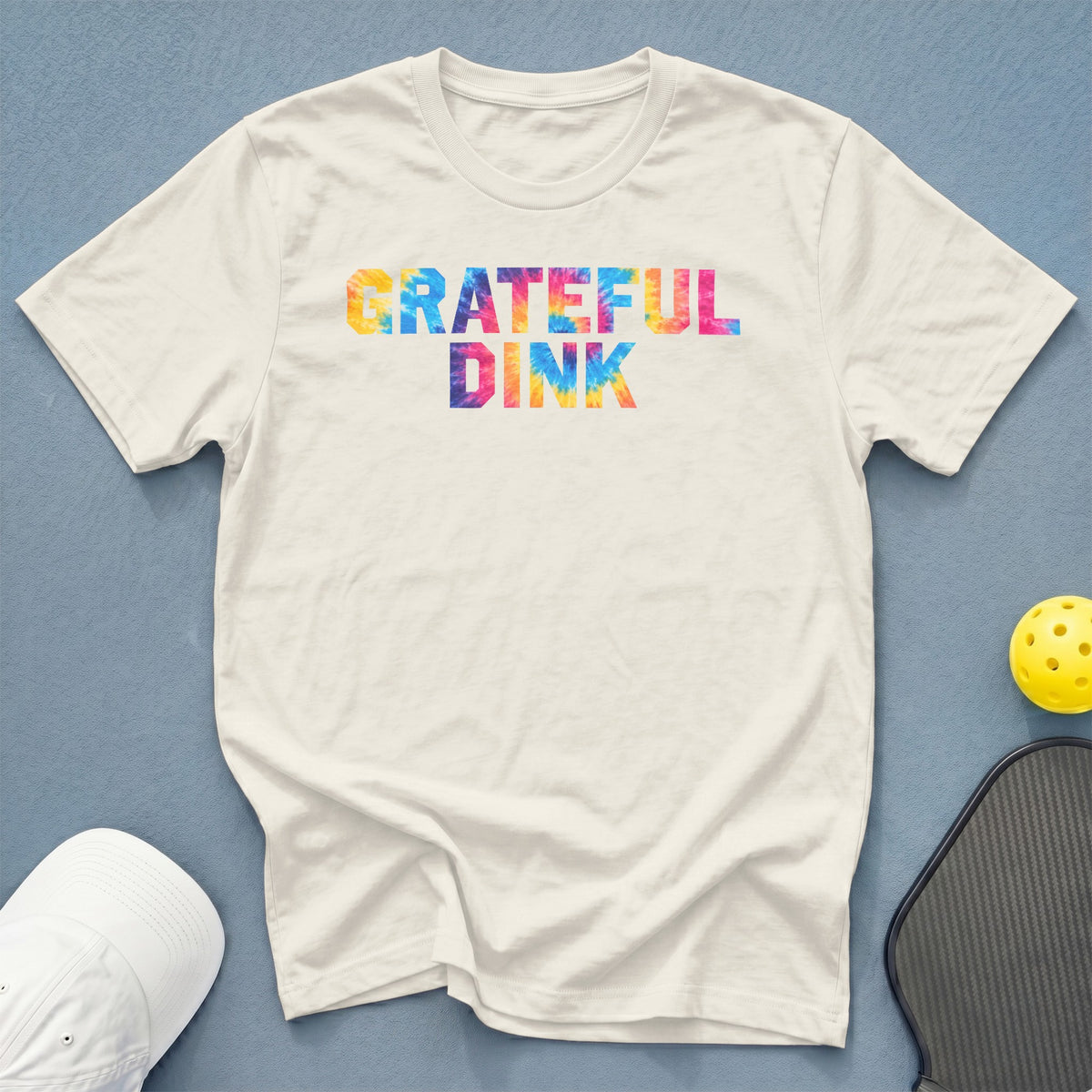 White t-shirt with "GRATEFUL DINK" in colorful tie-dye letters.