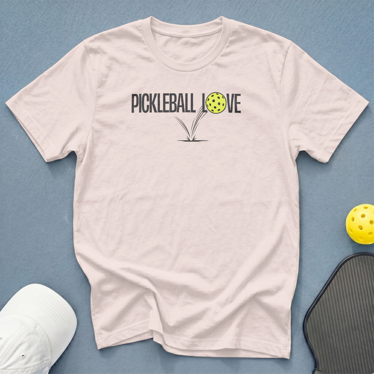 Light pink t-shirt with "Pickleball Love" graphic and pickleball.