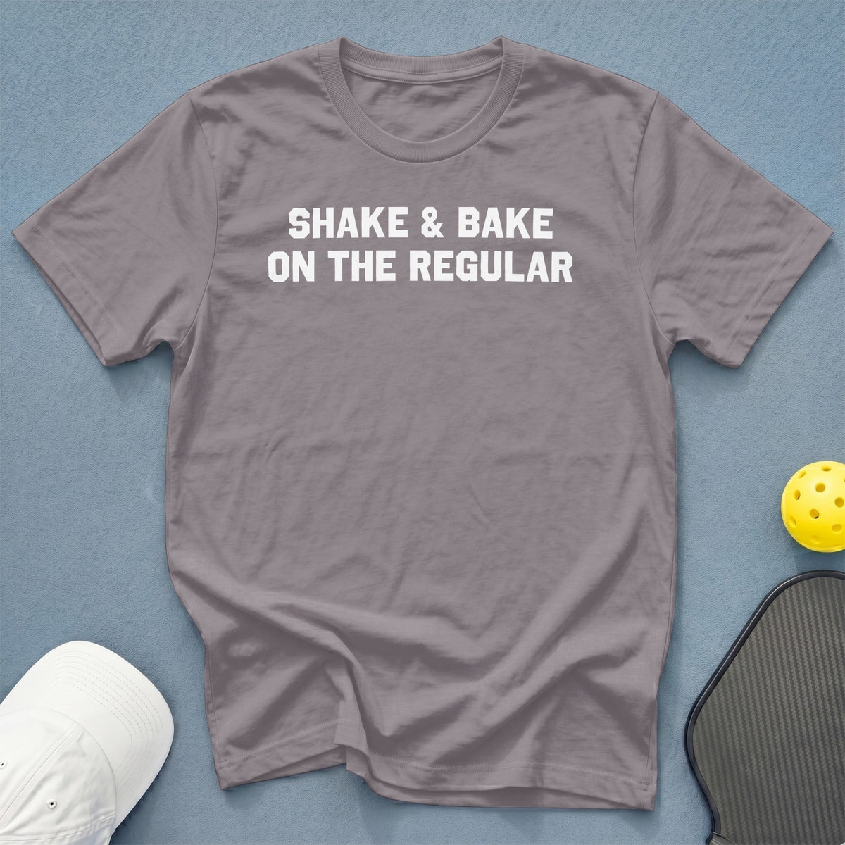 Gray t-shirt with white text "SHAKE & BAKE ON THE REGULAR".