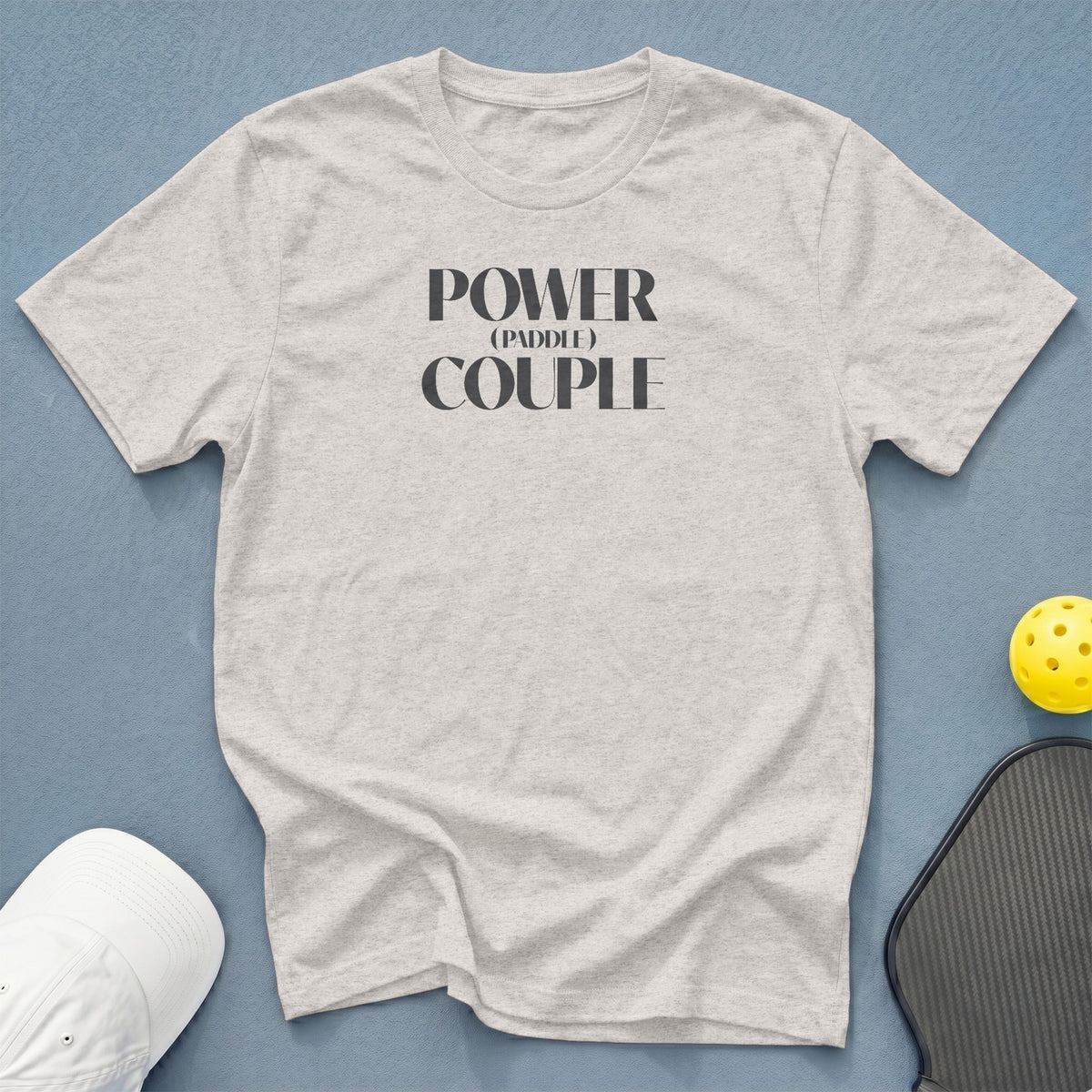 Light gray t-shirt with "POWER (PADDLE) COUPLE" graphic.