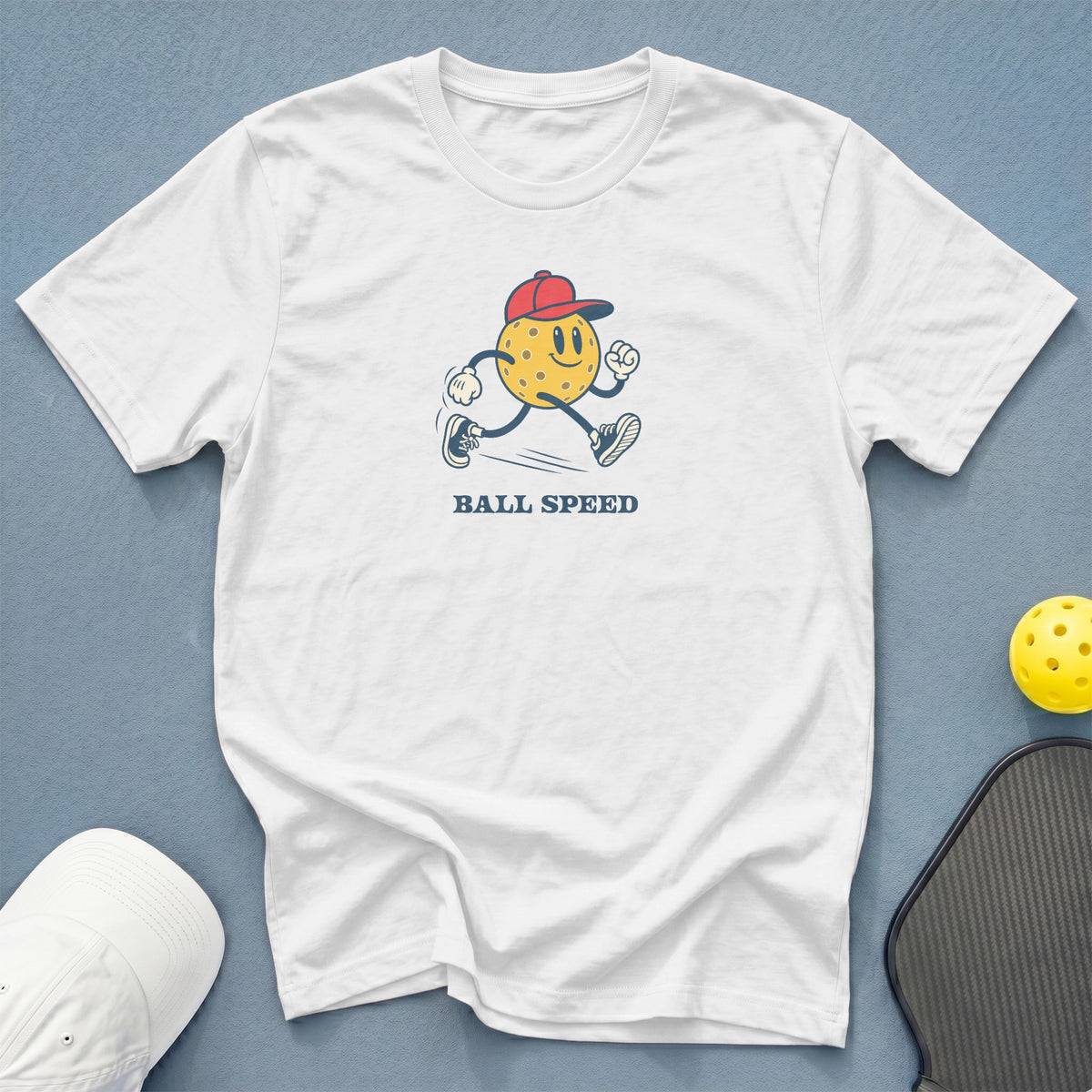White t-shirt with cartoon pickleball and "BALL SPEED" text.