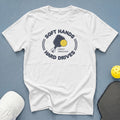 White t-shirt with pickleball graphic that reads "Soft Hands, Hard Drives, Simply Smashing!".