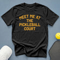 Black t-shirt with orange text "Meet Me At The Pickleball Court".