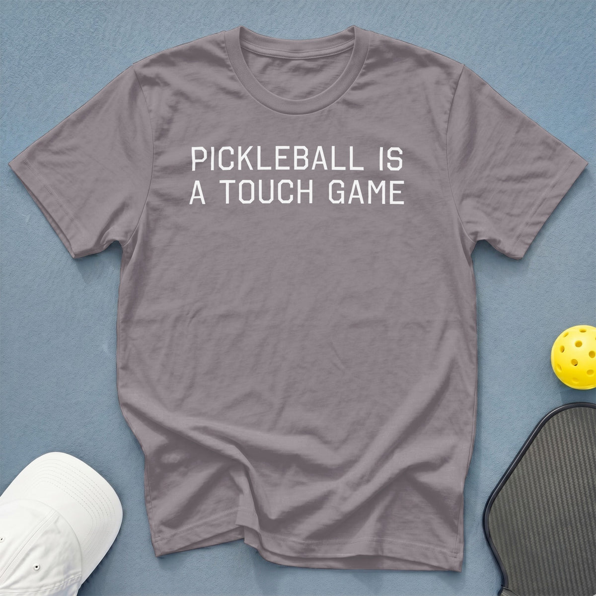 Gray t-shirt with white text "PICKLEBALL IS A TOUCH GAME".