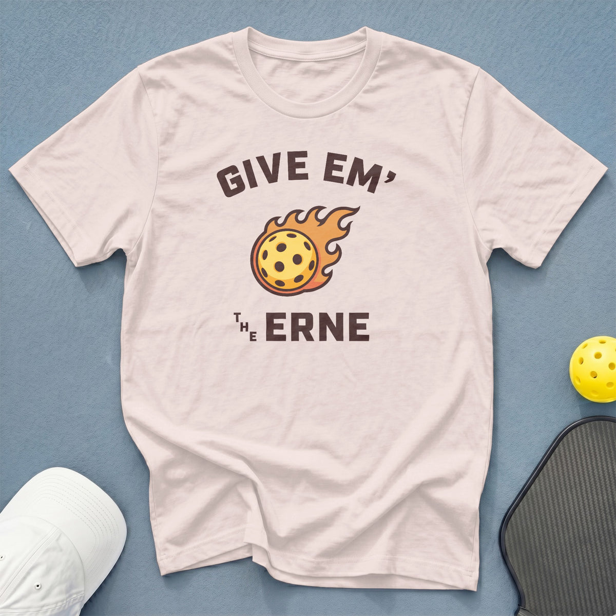 White t-shirt with graphic reading "GIVE EM' THE ERNE" and flaming pickleball.