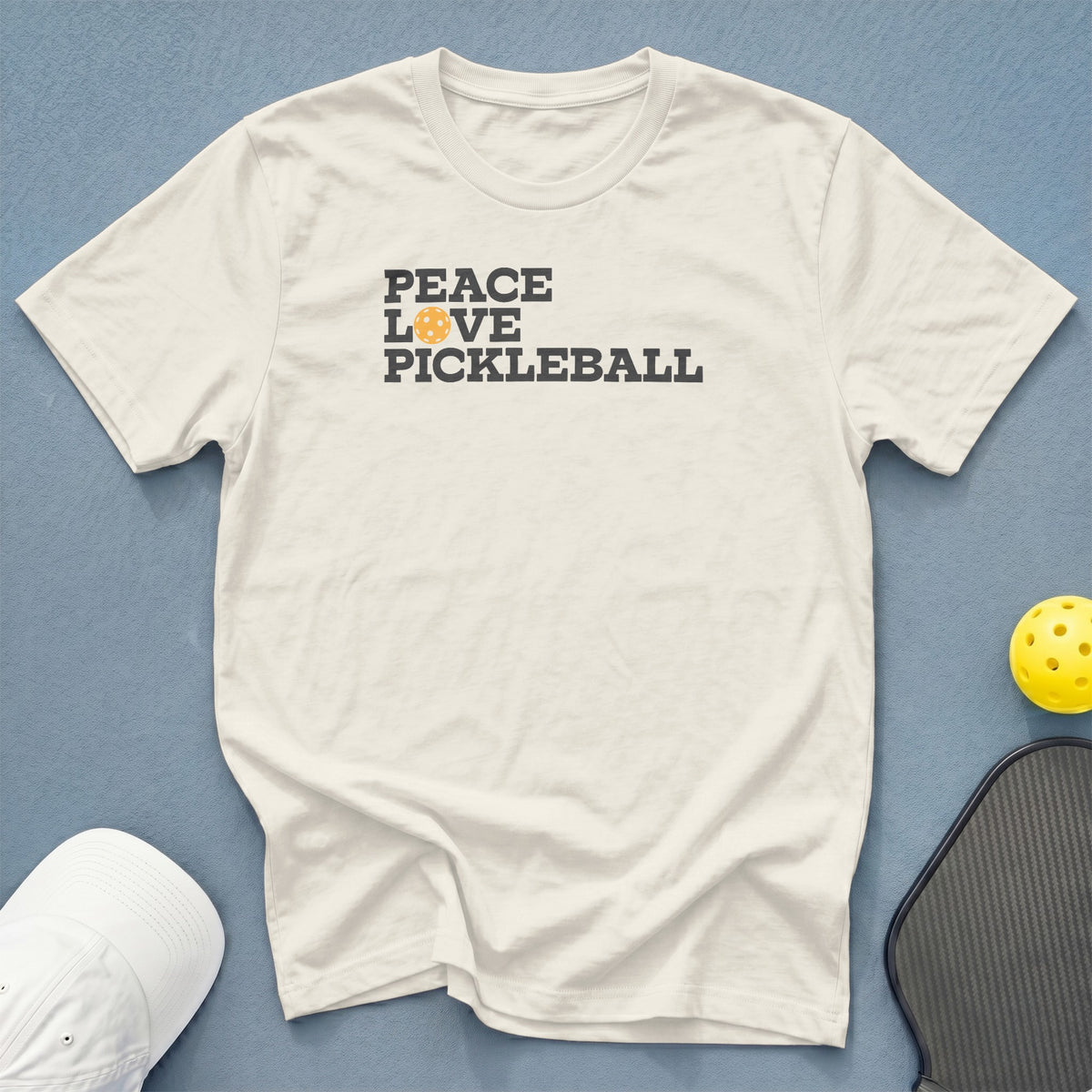Cream t-shirt with "Peace Love Pickleball" text and pickleball graphic.