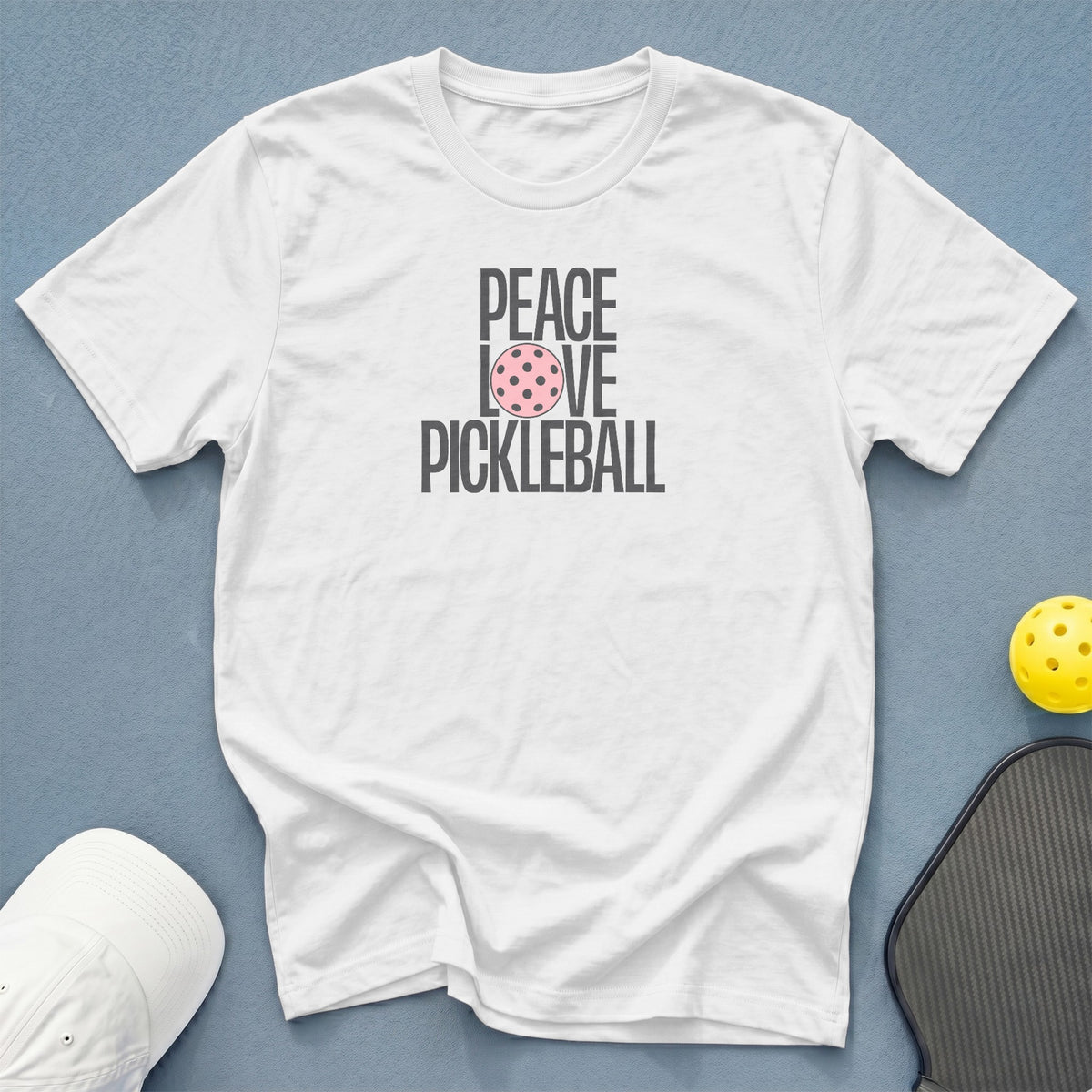 White t-shirt with "PEACE LOVE PICKLEBALL" text and pickleball graphic.