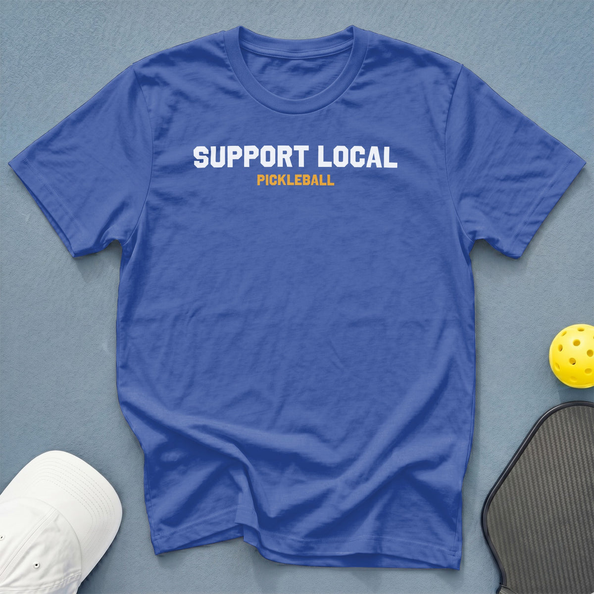 Royal blue t-shirt with "SUPPORT LOCAL PICKLEBALL" text.