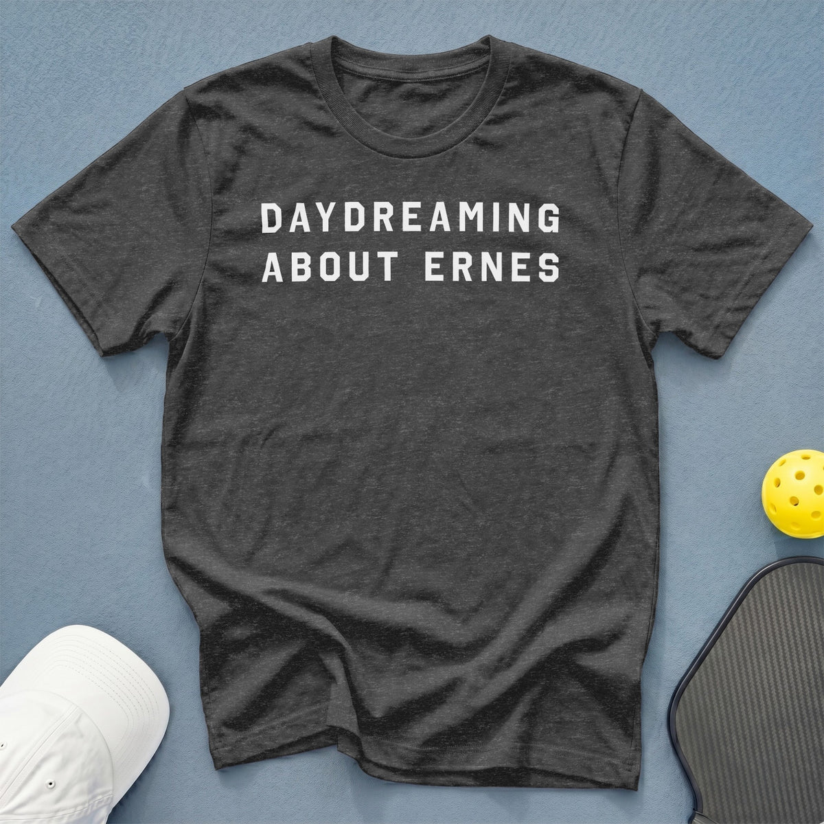 Dark grey t-shirt with white text reading "DAYDREAMING ABOUT ERNES".