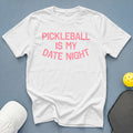 White t-shirt with pink text "PICKLEBALL IS MY DATE NIGHT"