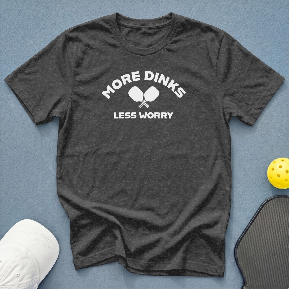 Dark grey t-shirt with "MORE DINKS LESS WORRY" and pickleball paddles.