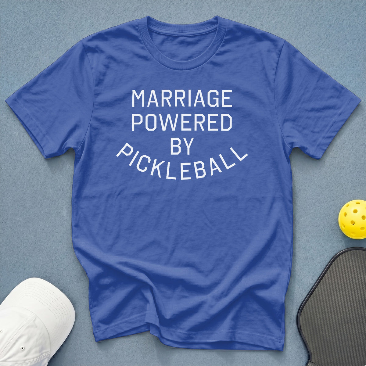 Blue t-shirt with white text "MARRIAGE POWERED BY PICKLEBALL".