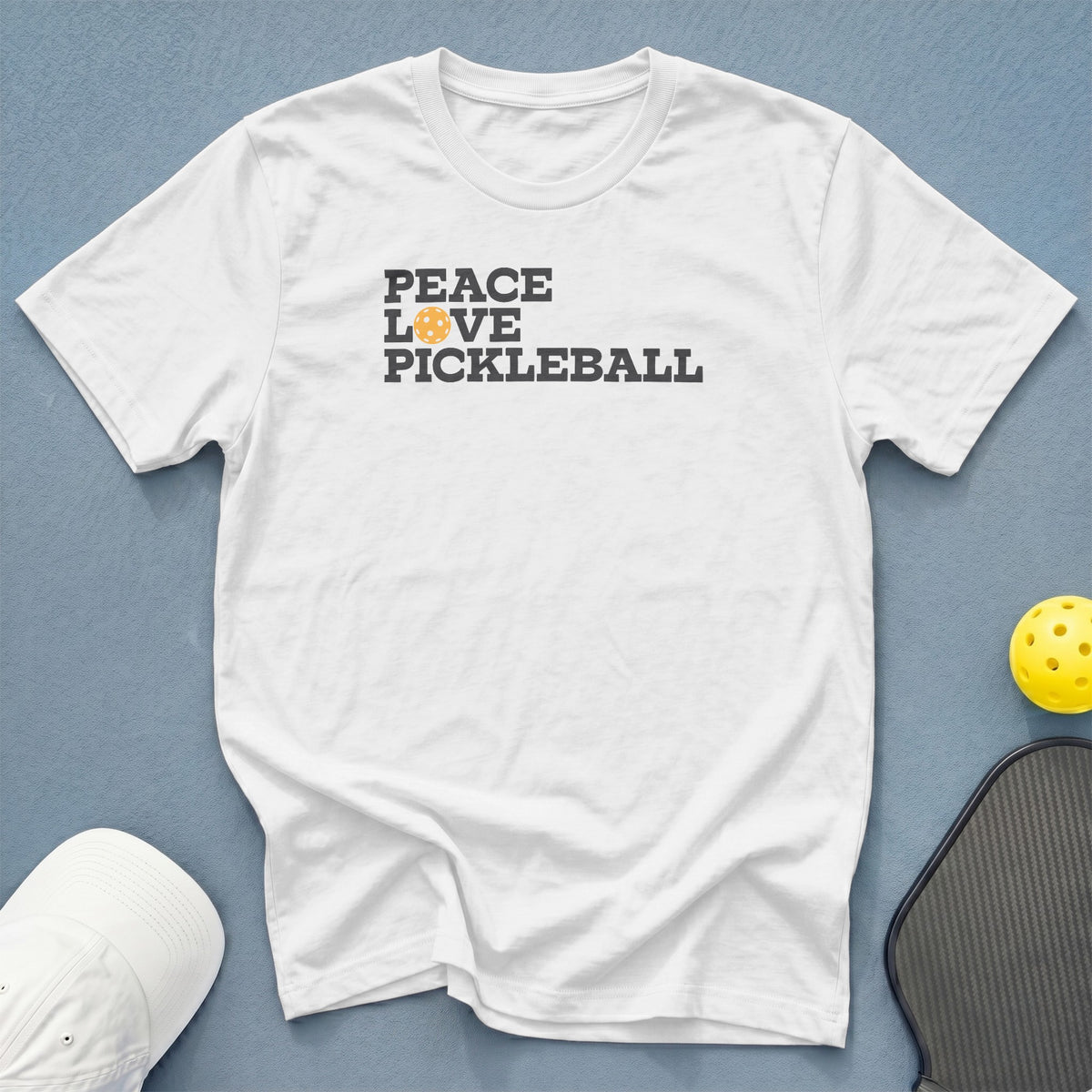 White t-shirt with "Peace Love Pickleball" text and pickleball graphic.