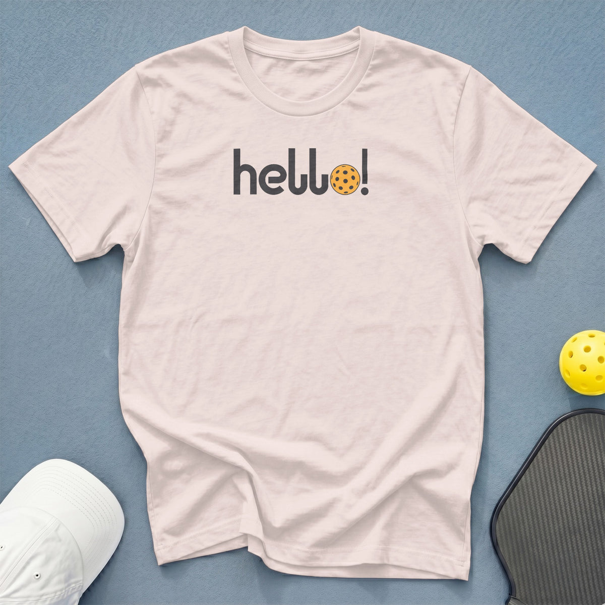 Light pink t-shirt with "hello!" and pickleball graphic.