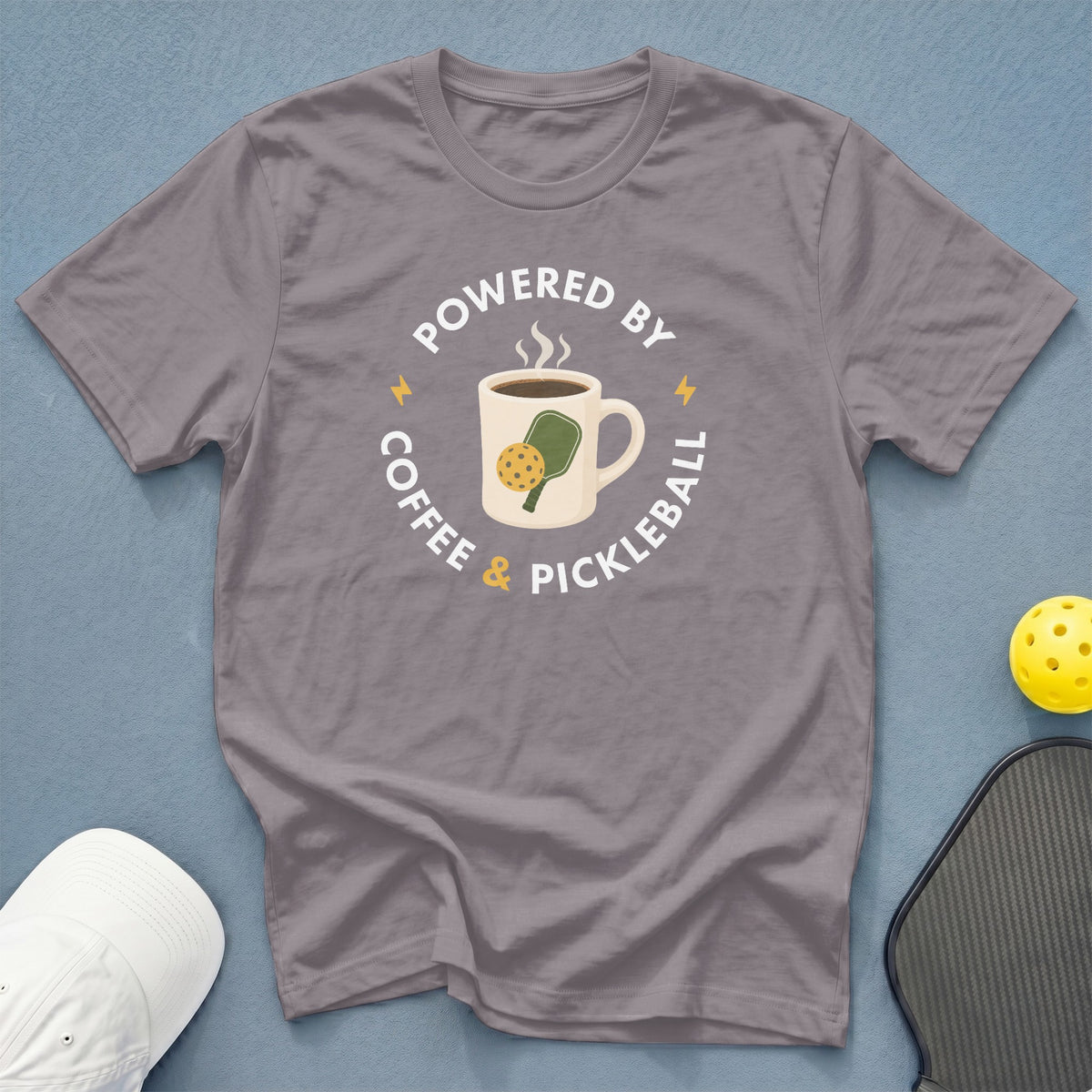 Gray t-shirt with "Powered by Coffee & Pickleball" text and graphic.