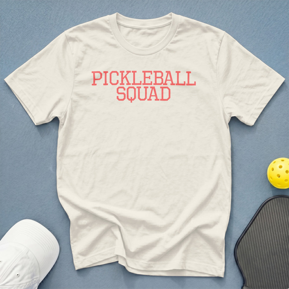 Off-white t-shirt with "PICKLEBALL SQUAD" in pink text.