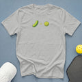 Grey t-shirt with pickle and pickleball graphic and plus sign.